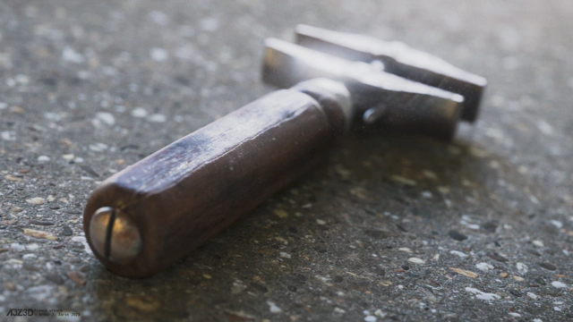A close up on the wrench's screw tightening the wooden handle.